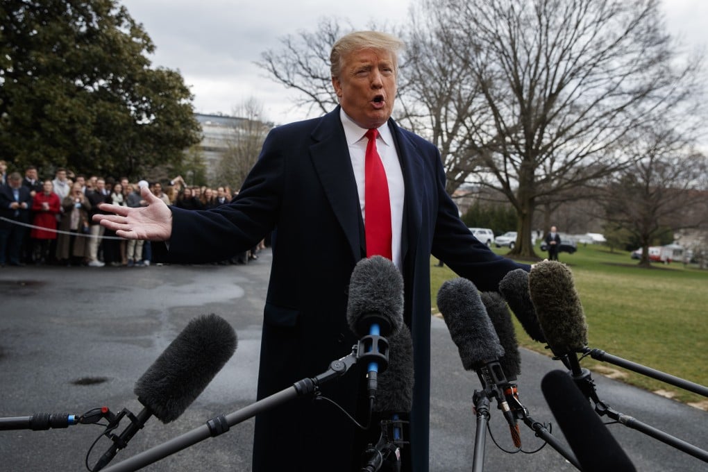 President Donald Trump talks with reporters before boarding Marine One on the South Lawn of the White House. Photo: AP Photo