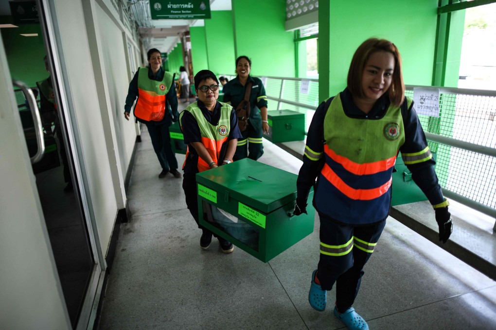 Electoral officials prepare ballot boxes and voting documents for distribution at an office in Bangkok. Photo: AFP