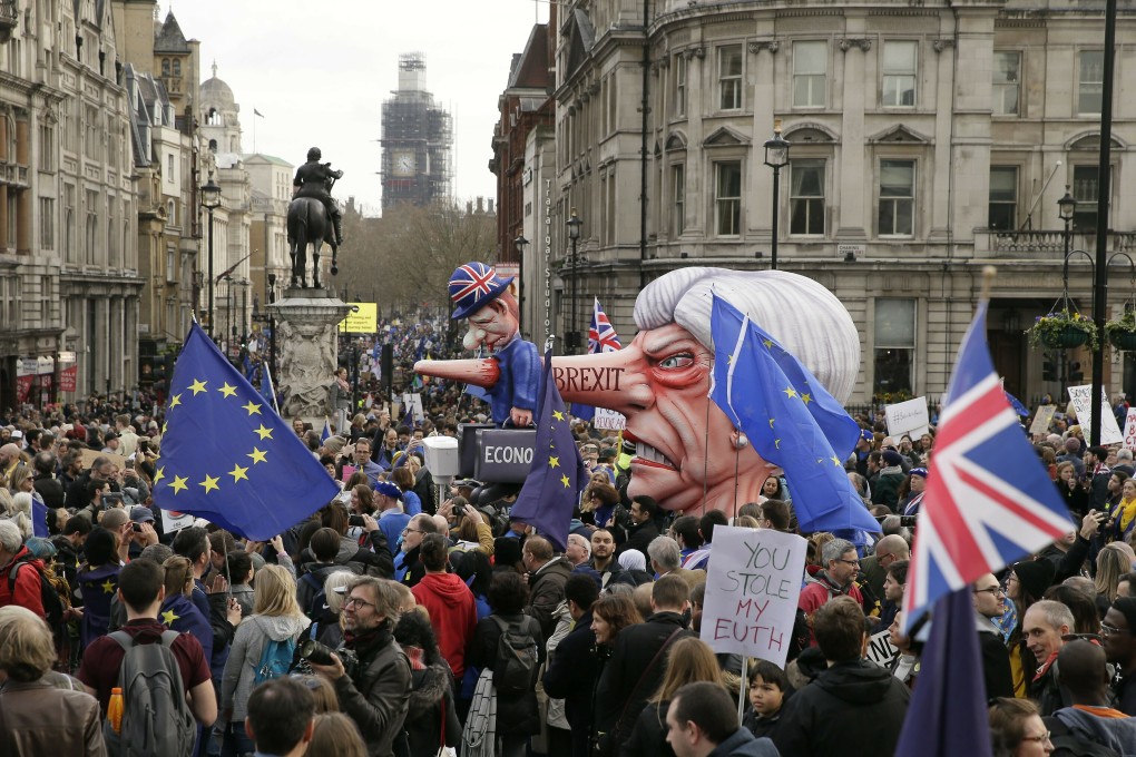 An effigy of British Prime Minister Theresa May is wheeled through Trafalgar Square. Photo: AP Photo