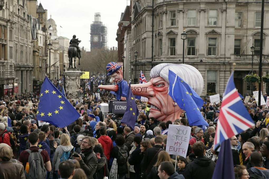 An effigy of British Prime Minister Theresa May is wheeled through Trafalgar Square. Photo: AP Photo