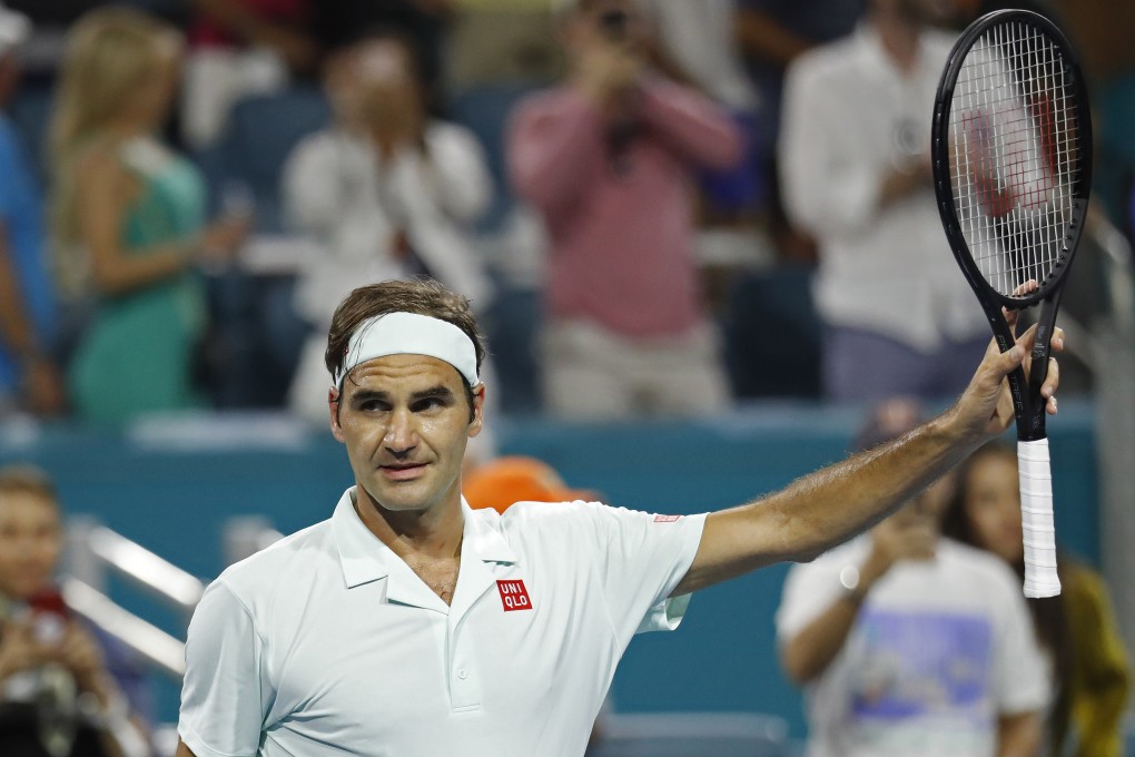 Roger Federer waves to the crowd after his match against Radu Albot at the Miami Open. Photo: USA Today