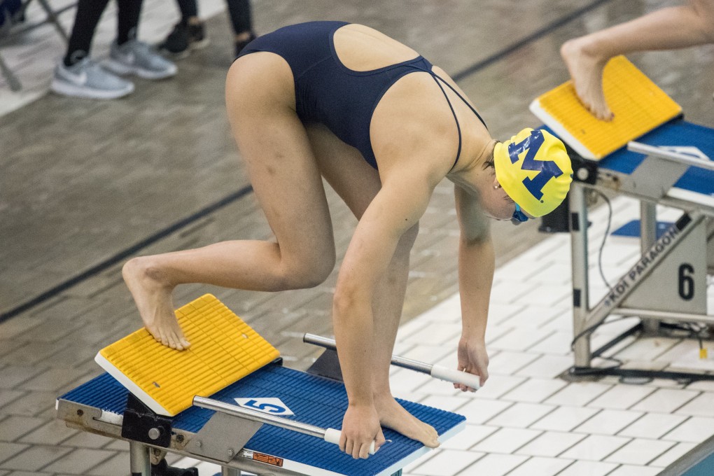 Siobhan Haughey on the starting blocks for the University of Michigan. Photo: Austin Thomason/University of Michigan