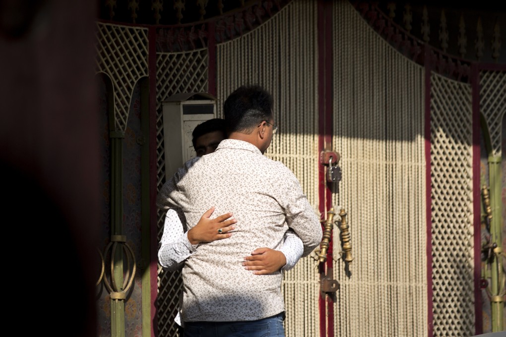 Relatives of an Indian national Ozair Kadir, who was killed in Christchurch mosque shootings, console each other as they arrive at Kadir's family home in Hyderabad, India. Photo: AP