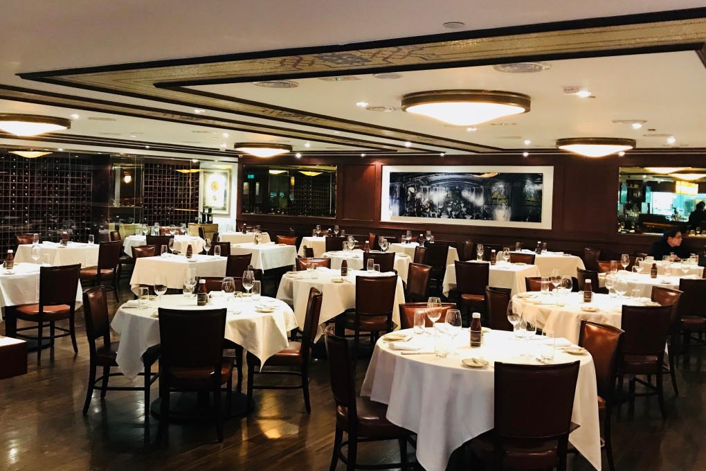 The decor is classic with white-clothed tables, leather and wood.