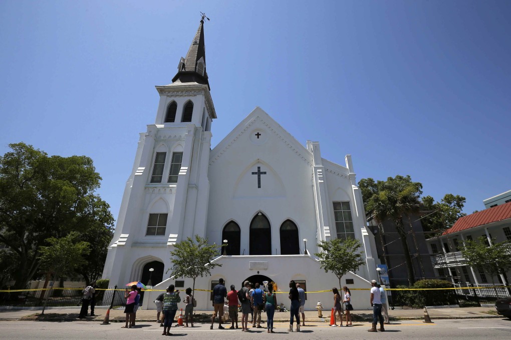 People gather outside Emanuel African Methodist Episcopal Church in Charleston, in the US state of South Carolina, a day after a mass shooting left nine dead in June 2015. Photo: Reuters