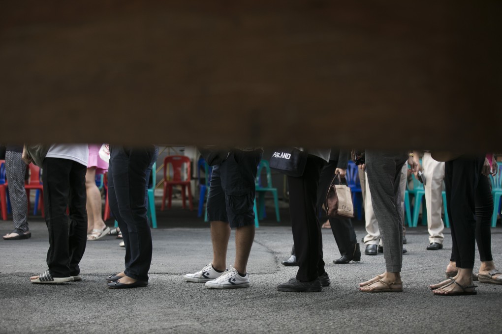 Voters line up to cast their ballots at a polling station in Bangkok, Thailand. Photo: Bloomberg