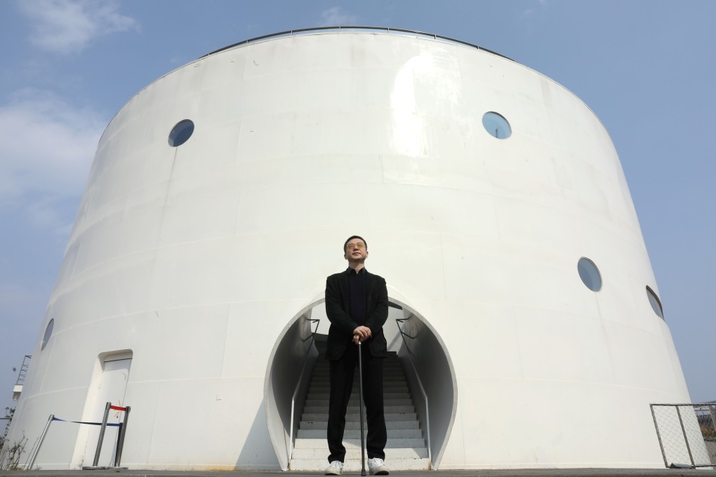 Qiao Zhibing, founder of Tank Shanghai, standing in front of one of the tanks. The art space officially opened to the public on March 23. Photo: Simon Song