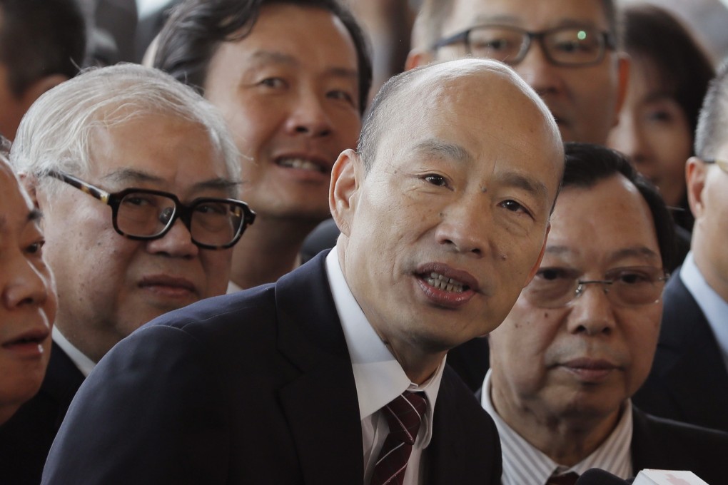 Mayor of Taiwan’s city of Kaohsiung Han Kuo-yu, center, speaks to the media after attending an agricultural and fisheries expo in Hong Kong on March 22. Photo: AP