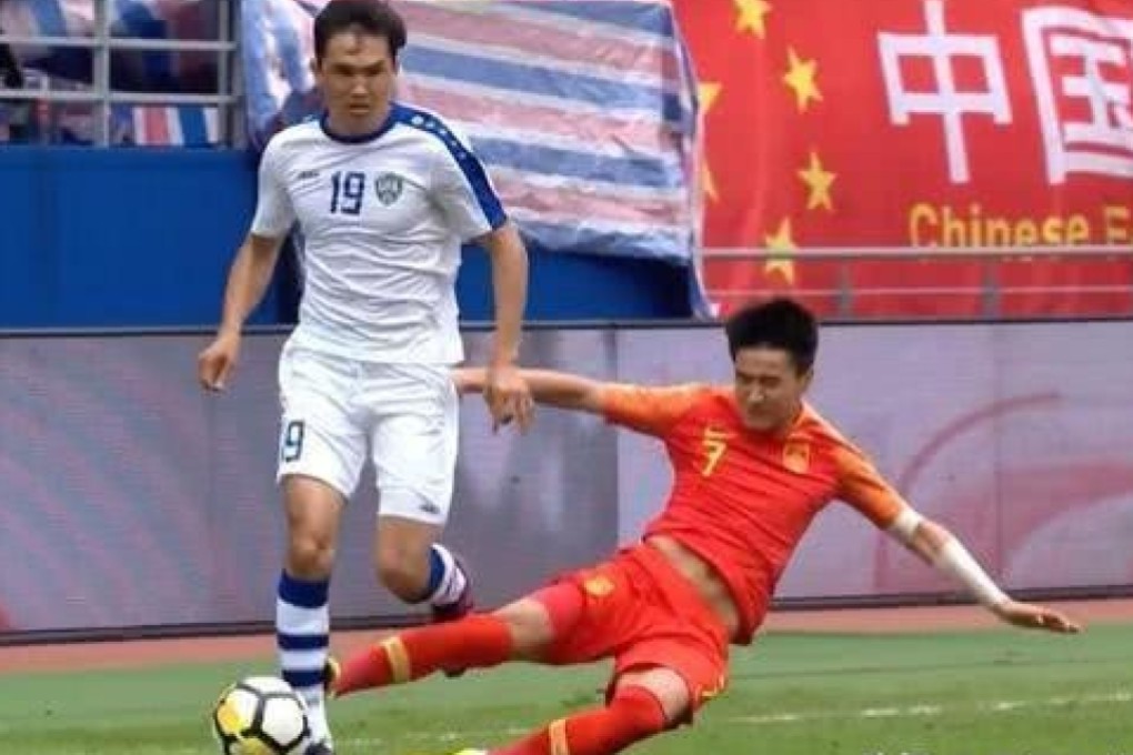 Wei Shihao tackles Obatek Shukurov – Chinese fans and media are up in arms about the ‘shameful’ foul. Photos: Weibo