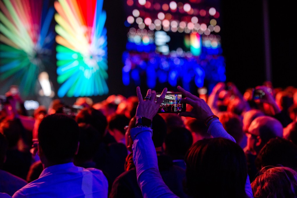 An attendee takes a smartphone photo during a Huawei Technologies launch event in Paris on Tuesday. Photo: Bloomberg
