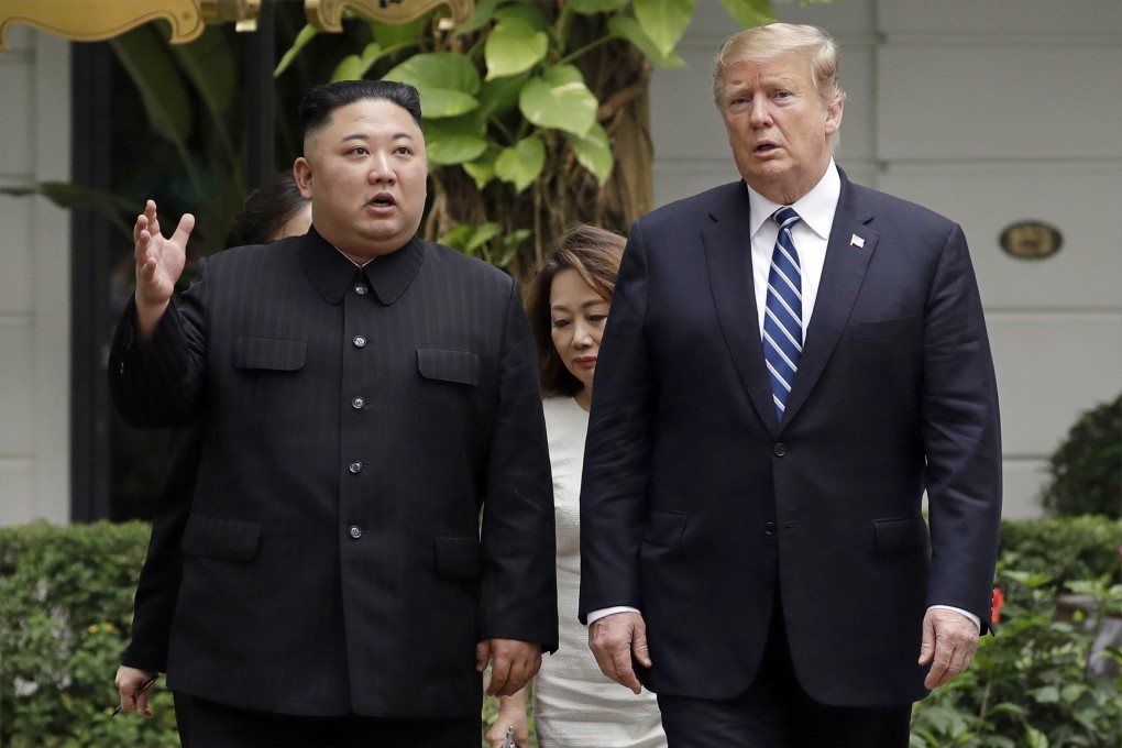 North Korean leader Kim Jong-un and US President Donald Trump walk together after their first meeting at the Hanoi summit. Photo: AP