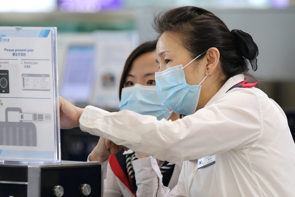 Staff at Hong Kong International Airport wear face masks during the measles outbreak. Photo: Dickson Lee