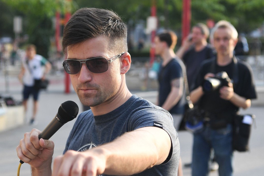 Local leader of the Identitarian Movement (IBOe) far right group, Martin Sellner speaking during a rally. Photo: AFP