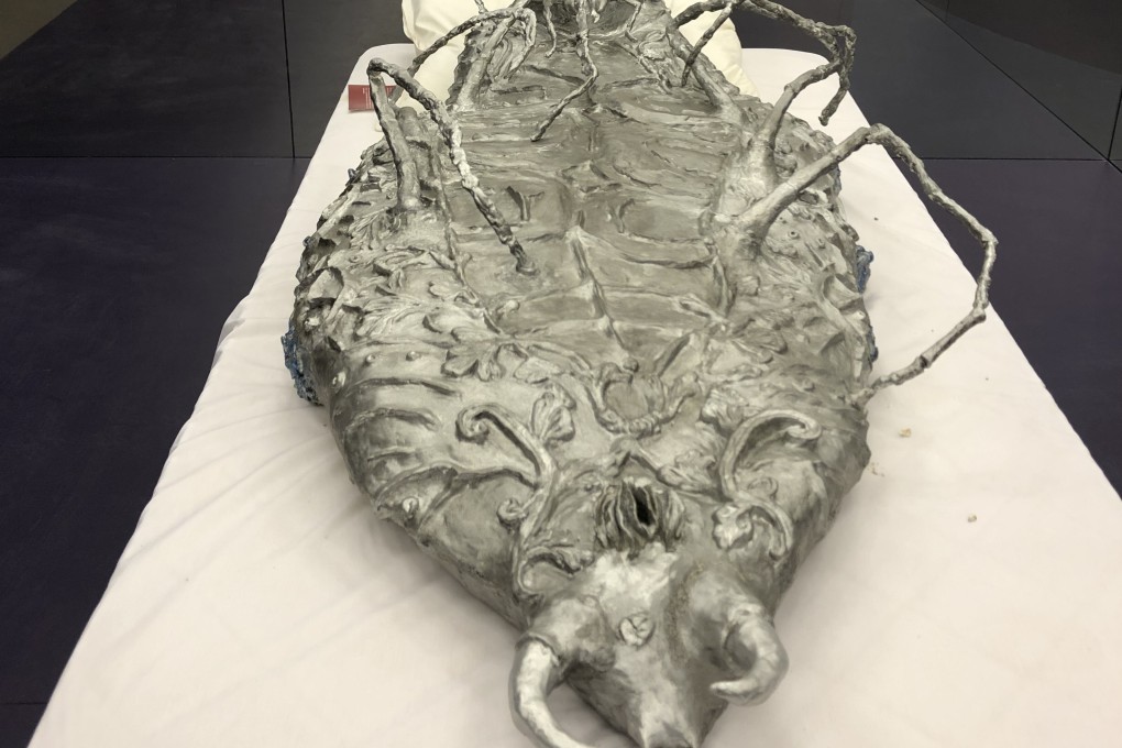 Metamorphosis in Space (human size cockroach), 2013, by Candice Lin, is part of the show An Opera for Animals at the Para Site art centre in Hong Kong. Photo: Enid Tsui
