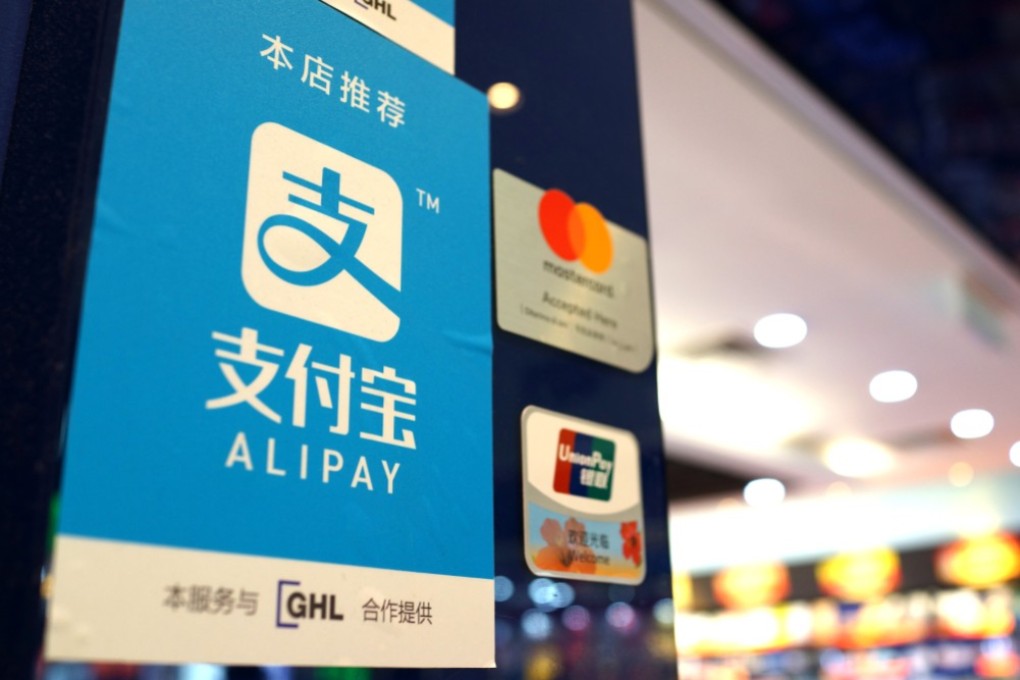 Signage support the use of Ant Financial Service Group’s Alipay smartphone-enabled payment platform, along side MasterCard and China UnionPay in Hong Kong. Photo: SCMP