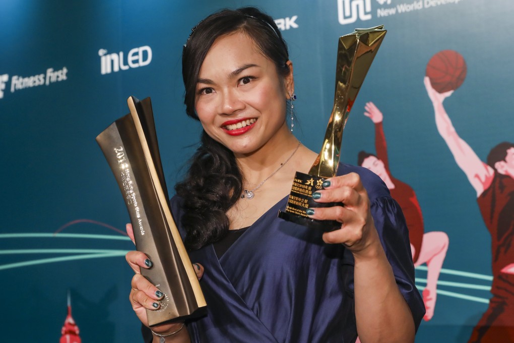 Hong Kong cyclist Sarah Lee shows off her trophies at the Hong Kong Sports Stars Awards in Wan Chai. Photo: K.Y. Cheng