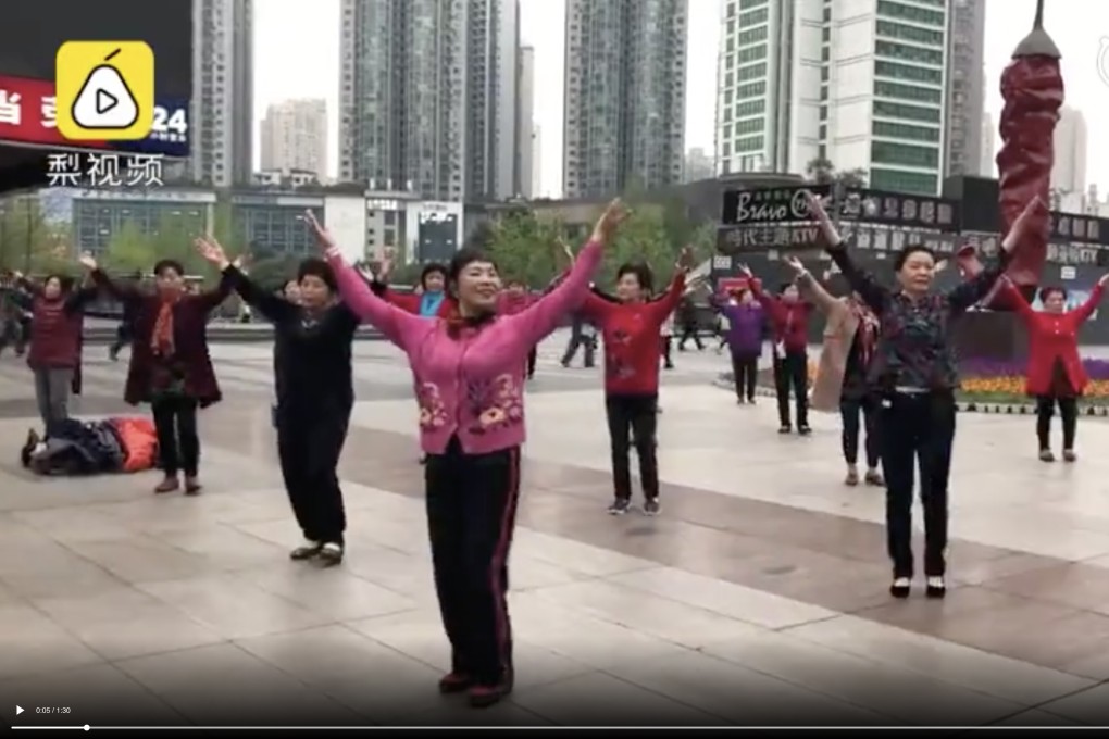 A shot from the video of a group of women in Chongqing dancing while listening to music through earphones; the video has drawn thousands of likes and praise. Photo: Pear Video