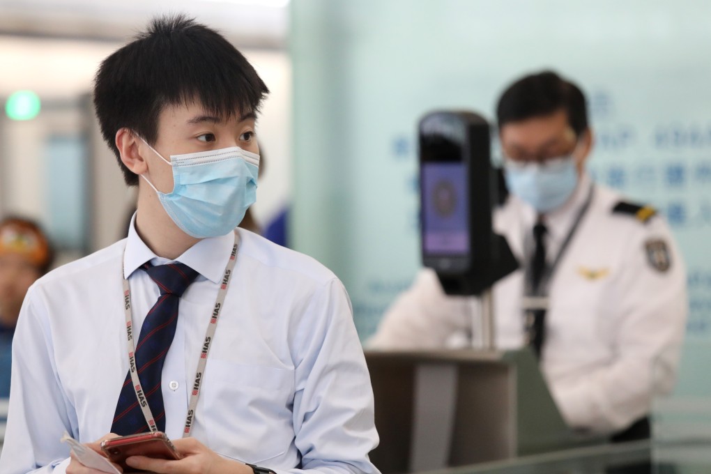 Staff at Hong Kong International Airport wearing face masks amid an outbreak of measles, which has affected a number of people working at the airport. Photo: Dickson Lee