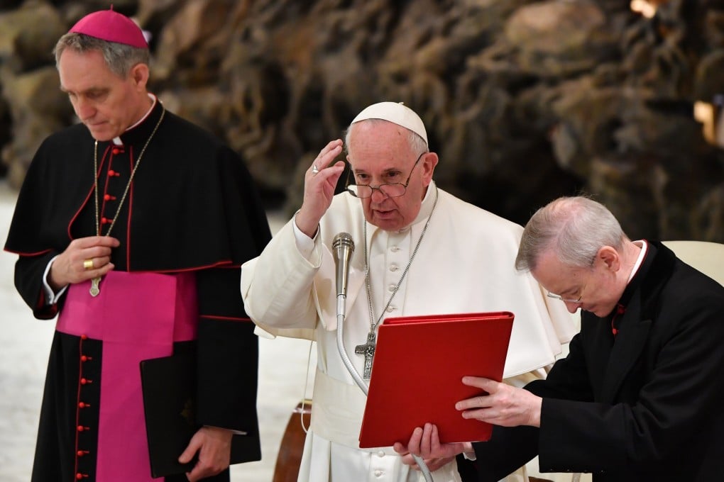 Pope Francis, flanked by Prefect of the papal household Georg Gaenswein (L). Photo: AFP