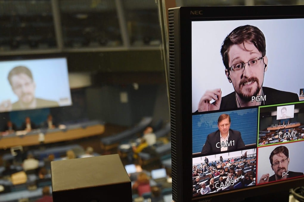 Whistle-blower Edward Snowden is seen on a screen in a control room as he takes part in a meeting at the Council of Europe in Strasbourg on March 15 via video conference from Russia. According to Snowden and journalist Glenn Greenwald, the US government has done what it accuses the Chinese of doing: implanting back-door surveillance tools in devices exported from the US. Photo: AFP