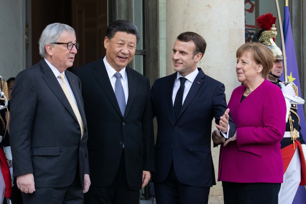 From left, European Commission leader Jean-Claude Juncker, Chinese President Xi Jinping, French President Emmanuel Macron and German Chancellor Angela Merkel gather for talks at the Elysee Palace in Paris on Tuesday. Photo: Bloomberg