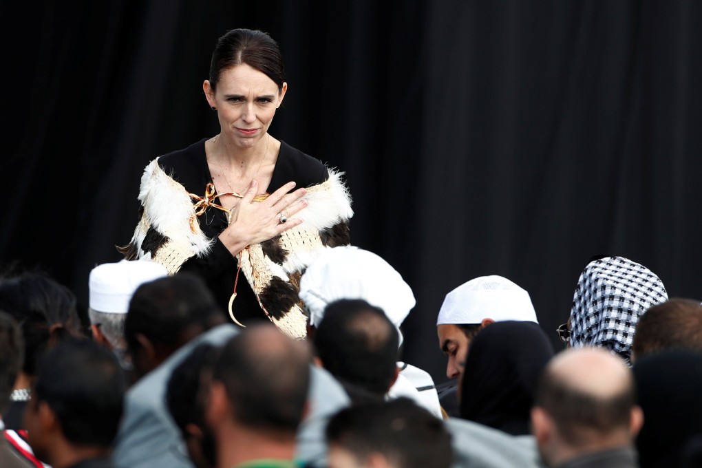 New Zealand's Prime Minister Jacinda Arden gestures to relatives of victims of the mosque attacks during the national remembrance service, at Hagley Park in Christchurch. Photo: Reuters
