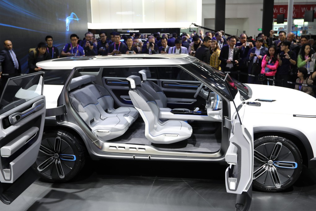 A Geely car is unveiled at the 2018 Beijing International Automotive Exhibition. Saxo Bank has already made headway in testing a prototype app in Geely cars in China. Photo: Simon Song