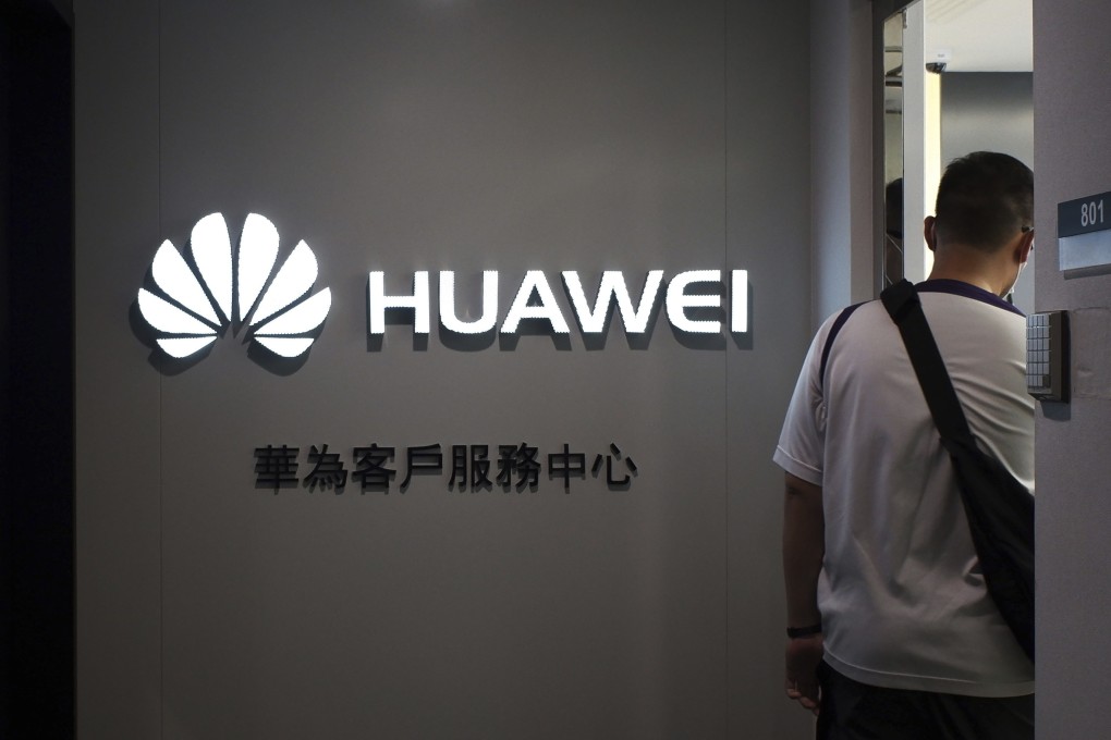 A man walks inside a Huawei customer service Centre in Hong Kong, Friday, March 29. Photo: AP