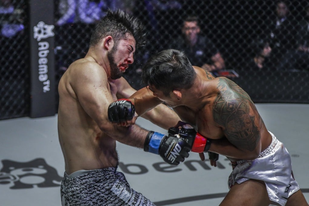 Aung La N Sang punches Ken Hasegawa during their One Championship title fight in Tokyo. Photos: One Championship