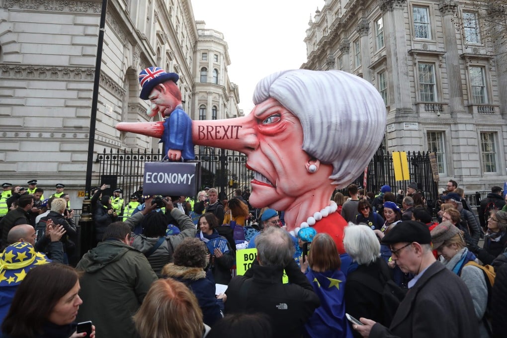 An effigy of Britain's Prime Minister Theresa May spearing a representation of the British economy is positioned outside Downing Street during a rally organised by the pro-European People's Vote campaign, calling for a second EU referendum on March 23, 2019. Photo: AFP
