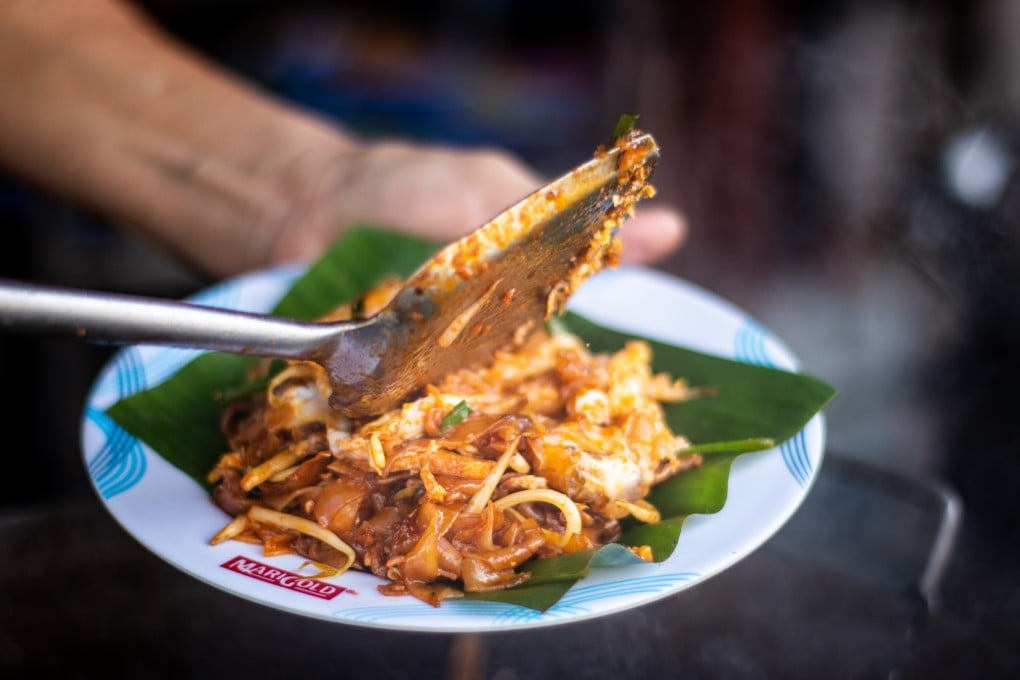 Char kway teow, a popular Penang street food dish made of rice noodles fried in soy sauce, chilli and shrimp paste, served with prawns, cockles, bean sprouts and sometimes lapcheong (Chinese sausage). Photo: Asyraf Abdul Samad