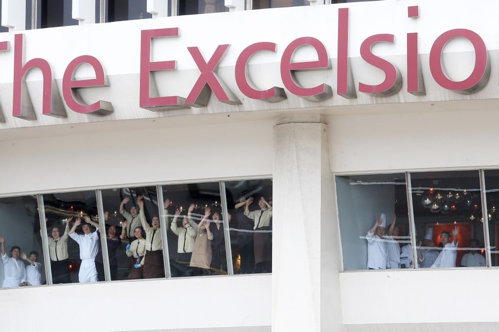 Employees bid farewell on the last day of hotel operations. Photo: Dickson Lee