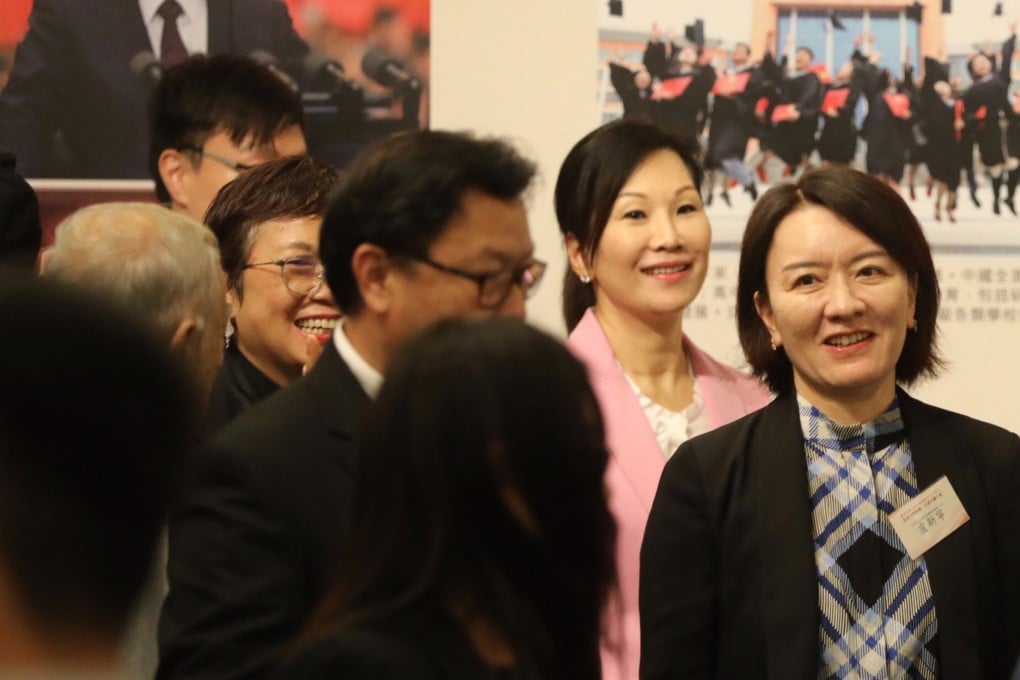 Lu Xinning (R), deputy director of Beijing’s liaison office, at a photo exhibition at Hong Kong Central Library on Tuesday. Photo: Sam Tsang