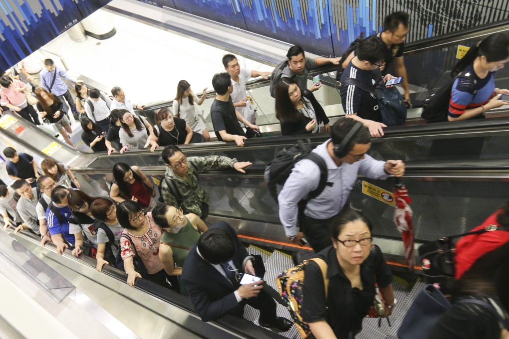 The MTR brainwashed commuters into standing on the right and walking on the left on escalators. Now that they have realised it wears out escalators, they are changing their tune. Photo: Dickson Lee