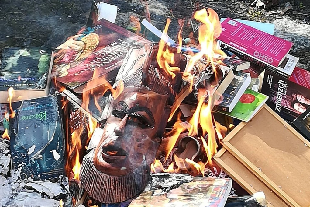 Objects said to carry evil powers, including Harry Potter books and an African mask are burned by Gdansk’s Mother of Church Catholic parish on Sunday. Photo: Facebook / SMS z Nieba