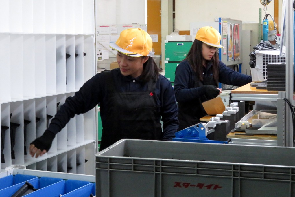 Trainee workers at a car parts factory in Hiroshima prefecture, western Japan. Photo: Reuters