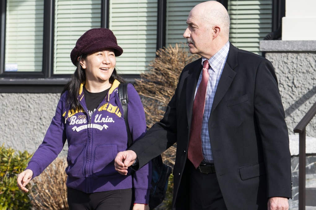 Huawei executive Meng Wanzhou shares a laugh with her driver as she leaves her home in Vancouver for the start of her extradition hearing on March 6. Photo: EPA-EFE