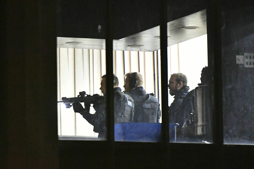 Armed police officers inside a London mosque on March 28, 2019 after a man with stab wounds was found nearby. Photo: AP
