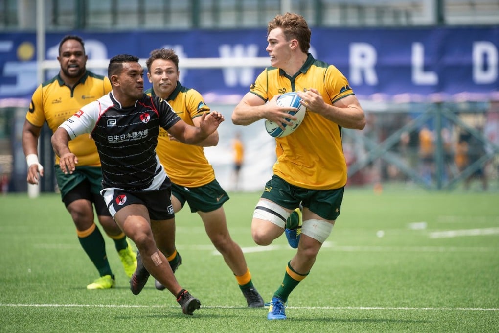 Asia Pacific Dragons (in black) vs Classic Wallabies (in yellow) during GFI HKFC Rugby Tens in Hong Kong Football Club, Hong Kong. Photo: David Paul Morris/Clique Visuals