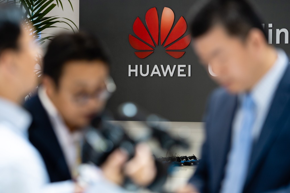 Visitors attend the Huawei booth at the Hannover Industry Fair in Germany on Monday. Photo: EPA