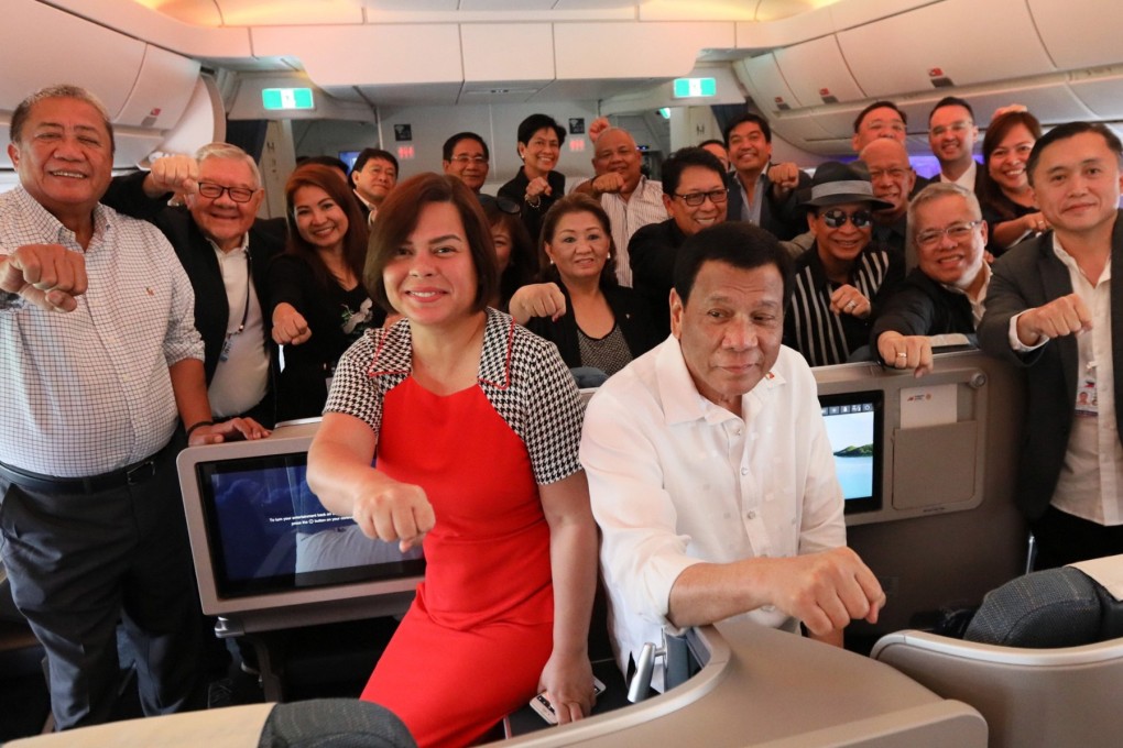 President Rodrigo Duterte with his daughter, Davao city mayor Sara Duterte-Carpio and members of his delegation on a flight bound for Israel. Photo: EPA