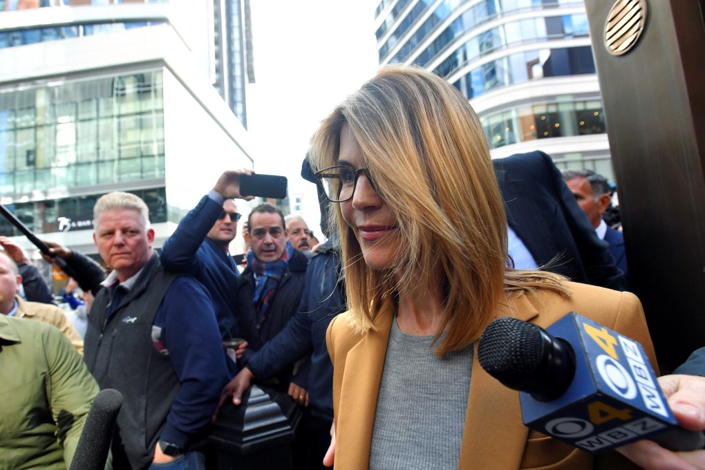 Lori Loughlin leaves the federal courthouse after facing charges in a nationwide college admissions cheating scheme in Boston, Massachusetts, on Wednesday. Photo: Reuters