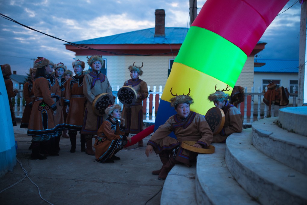 Youngsters prepare to perform at the annual fire festival in the Xine Oroqen settlement, in China’s northeastern Heilongjiang province. Photo: Nathan Gibson
