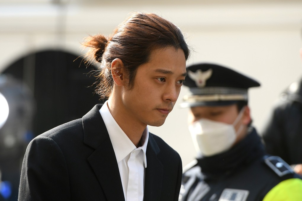 K-pop star Jung Joon-young arrives for questioning at the Seoul Metropolitan Police Agency in Seoul on March 14. Photo: AFP/Getty Images via TNS