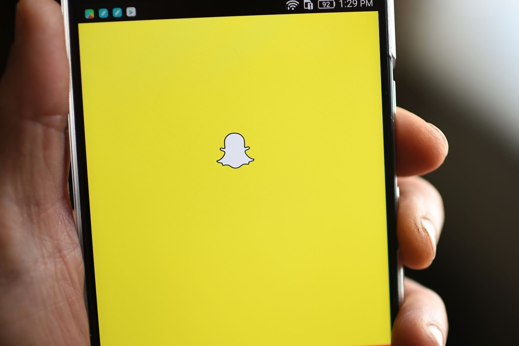 Snapchat logo on mobile phone. Photo: AFP