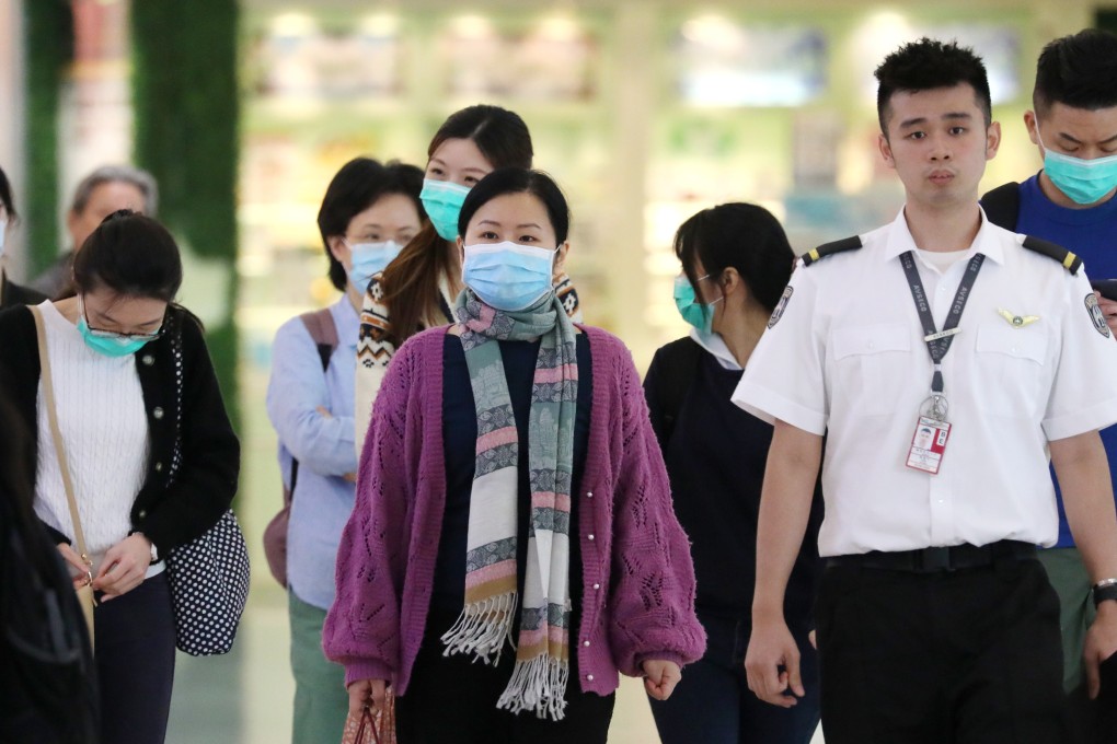 People at Hong Kong International Airport wearing masks. Photo: Felix Wong