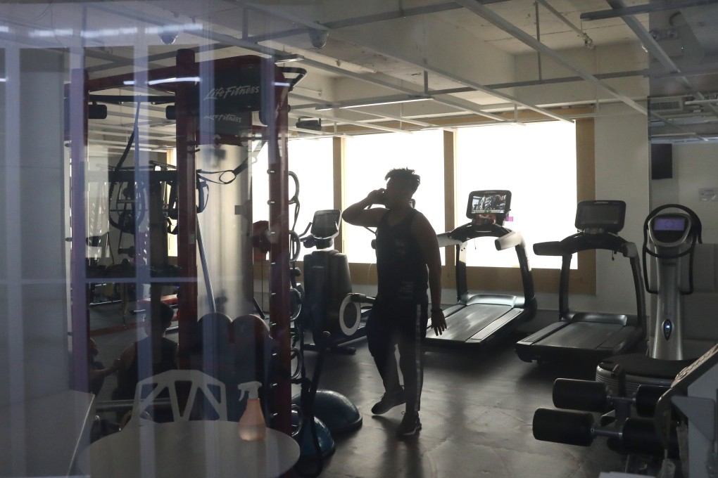 A Legend Fight and Fitness employee threatens to call police when asked about aggressive sales practices at the gym. Photo: Nora Tam