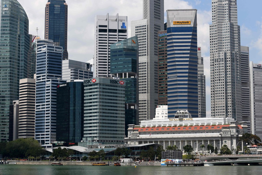 Singapore’s central business district is bustling by day and close to deserted on a weekend. Its government wants to change this. Photo: AFP