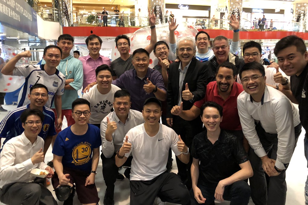 Members of Men’s Fraternity after a “Soccer on Ice” event at the Taikoo Shing ice rink in Hong Kong.