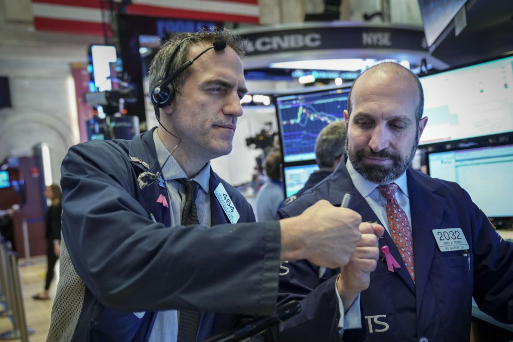 Traders work on the floor of the New York Stock Exchange ahead of the opening bell on January 4. The Dow Jones Industrial Average got off to a strong start that morning. Photo: Getty Images/AFP